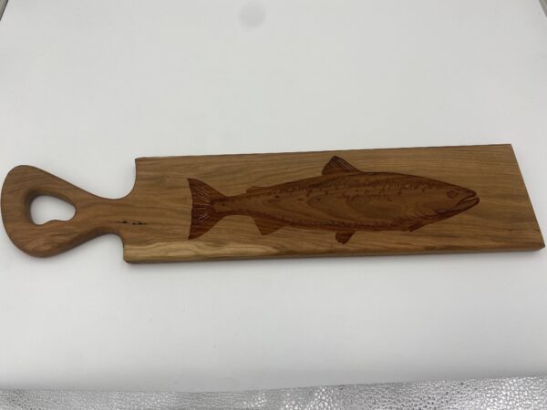 charcuterie board with fish engraving
